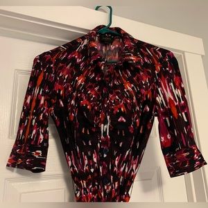 Womens fun full of color button up dress with collar and tie around the waist.